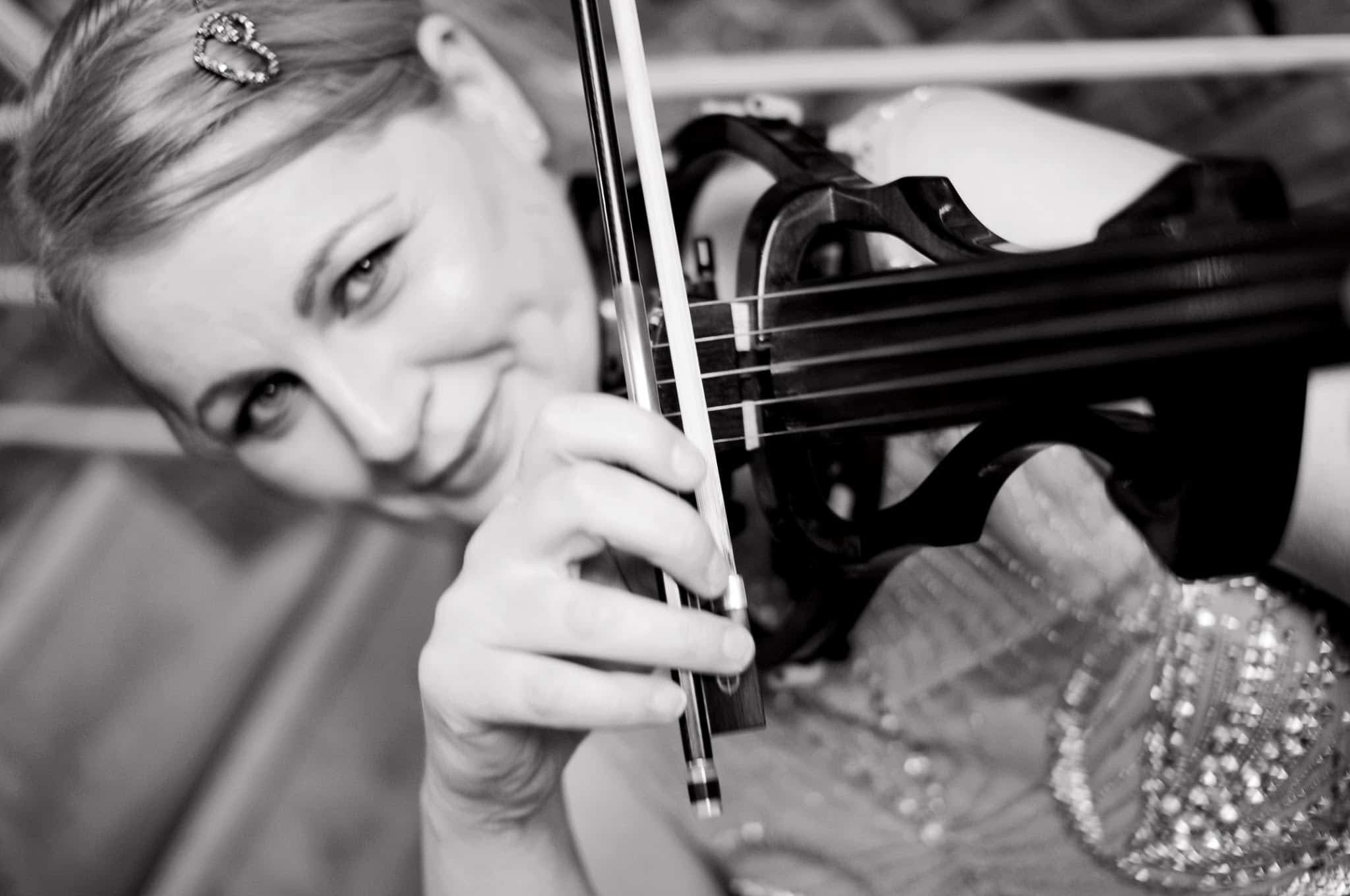 Celeste performing on electric violin