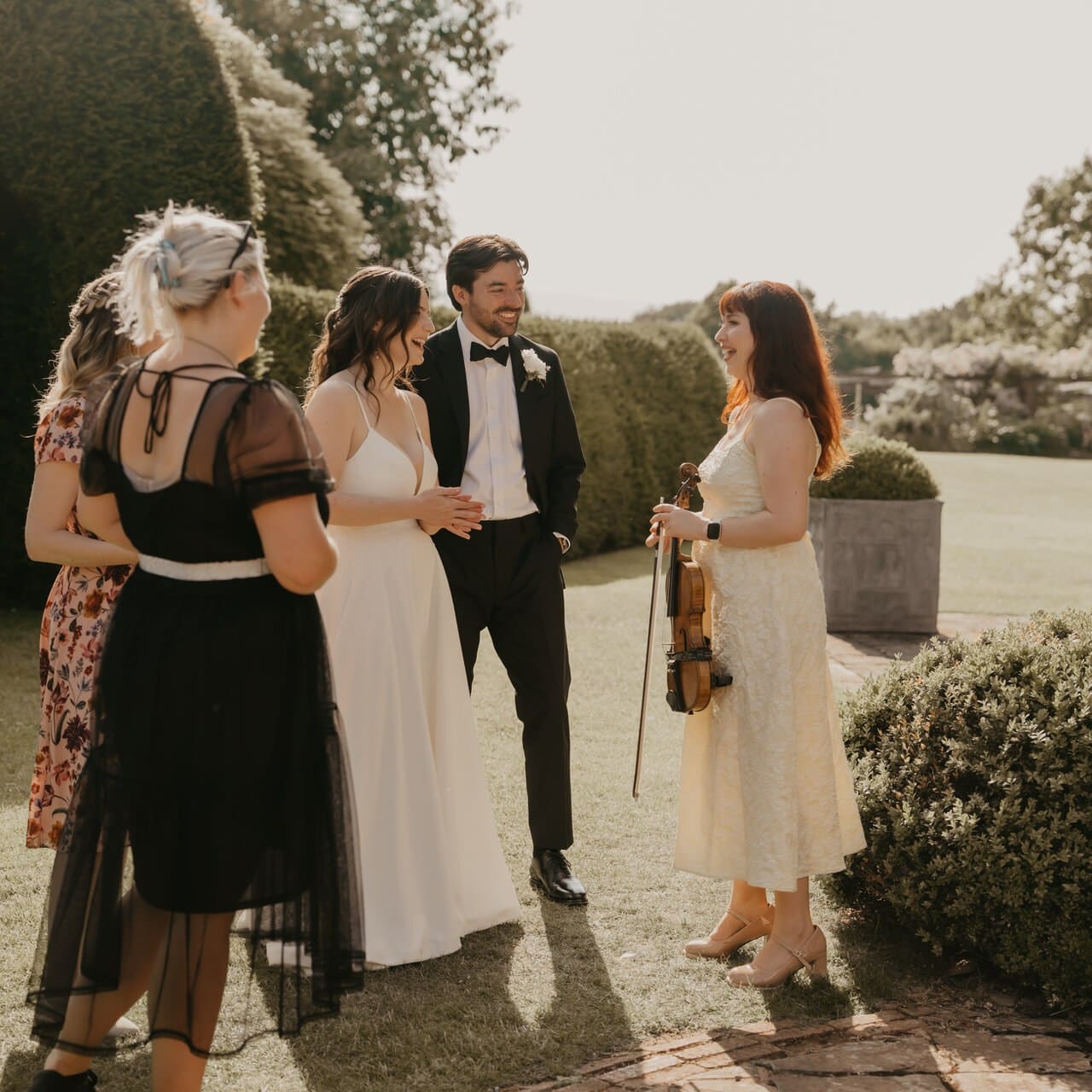 Aria playing the violin at a wedding