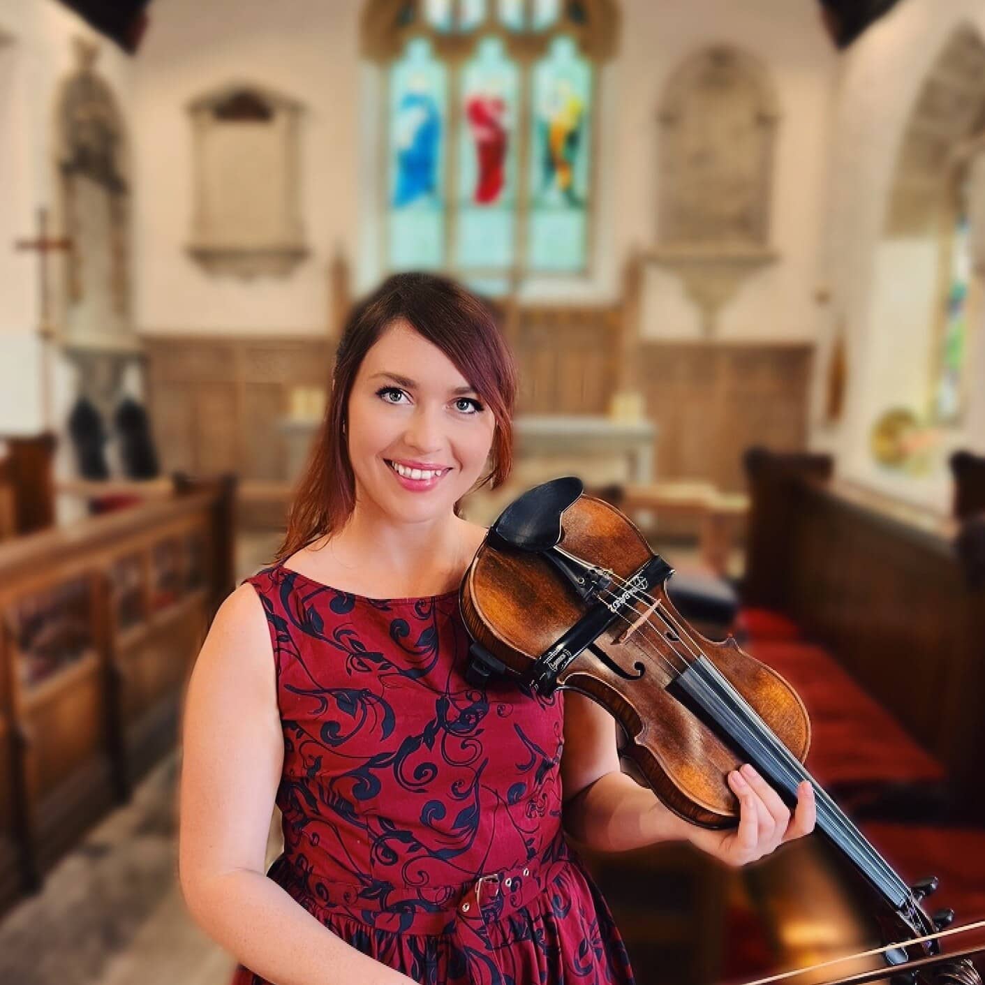 Aria playing the violin in a church