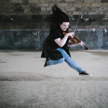 Cavatina playing the violin outdoors