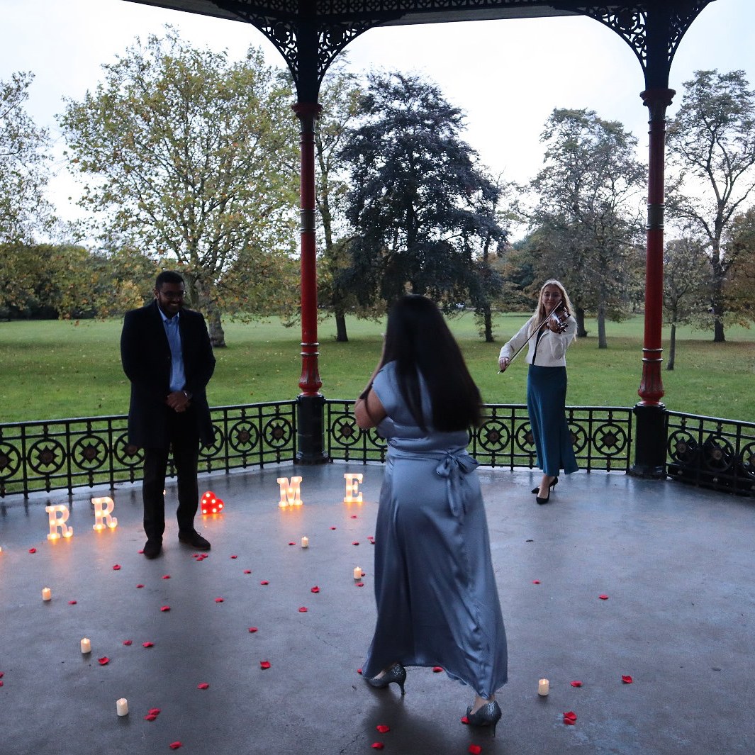Lyra playing at a wedding